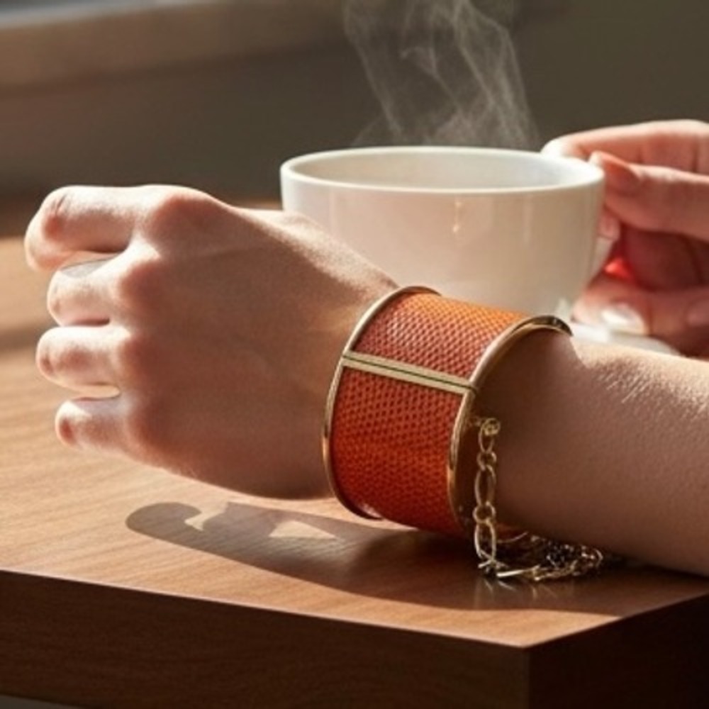 Orange Lizard Embossed Gold Tone Wide Hinge Cuff Bracelet with Safety Chain‎